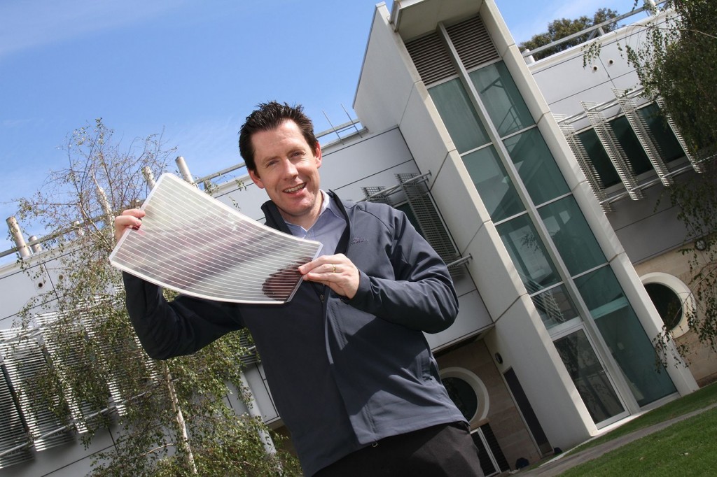 CSIRO materials scientist Dr. Scott Watkins holding one of the new photovoltaic cells. Courtesy of CSIRO.