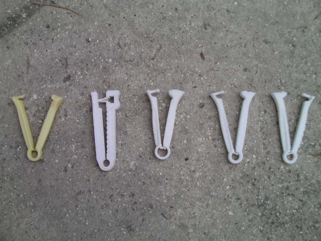 The umbilical cord clamps printed in Haiti have undergone some design iterations, as can be seen by examining the original clamp (far left) and new models. Courtesy of Field Ready.