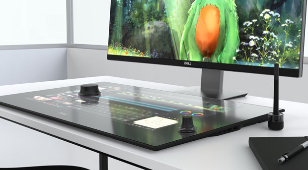 The soon-to-be-available Dell Canvas creates a smart workspace where you interact with design, engineering and creative applications using touch commands, a digital pen and a puck-shaped hand-held device known as a totem. Image courtesy of Dell Inc.