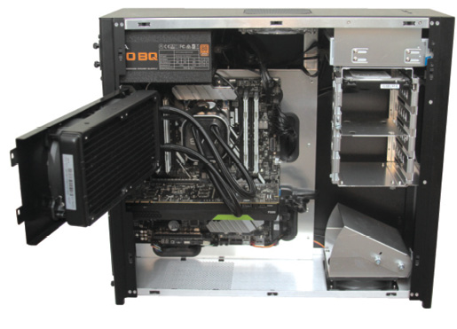 The interior of the case is spacious, but users must swing the cooling radiator out of the way to access the CPU and memory sockets. Image courtesy of David Cohn.