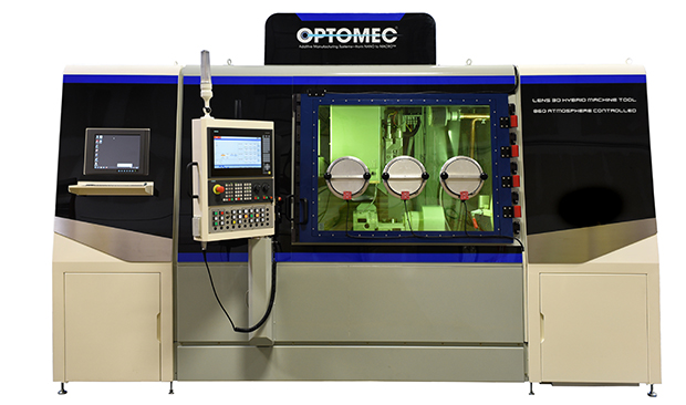The LENS 860 Hybrid CA system is equipped with a hermetically-sealed build chamber that maintains oxygen and moisture levels below 40 ppm for processing reactive metals, such as Titanium. Image courtesy of Optomec.